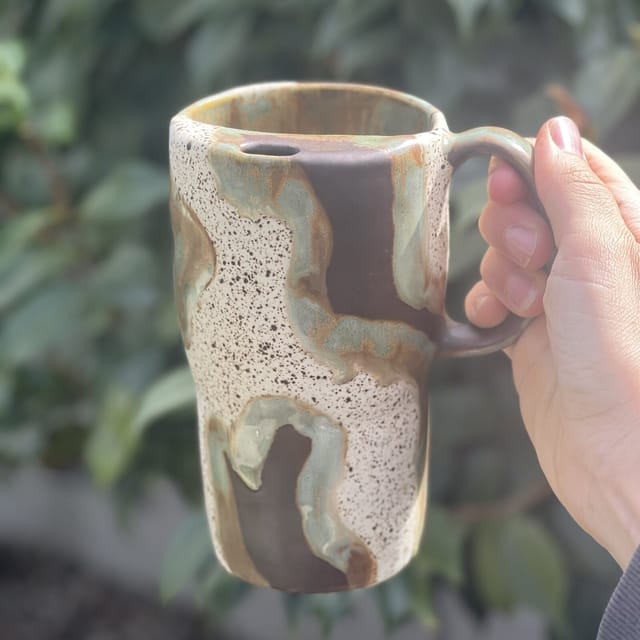 Tumbleweed Speckle Mug — A tall speckled mug with rawhide-brown glaze drips